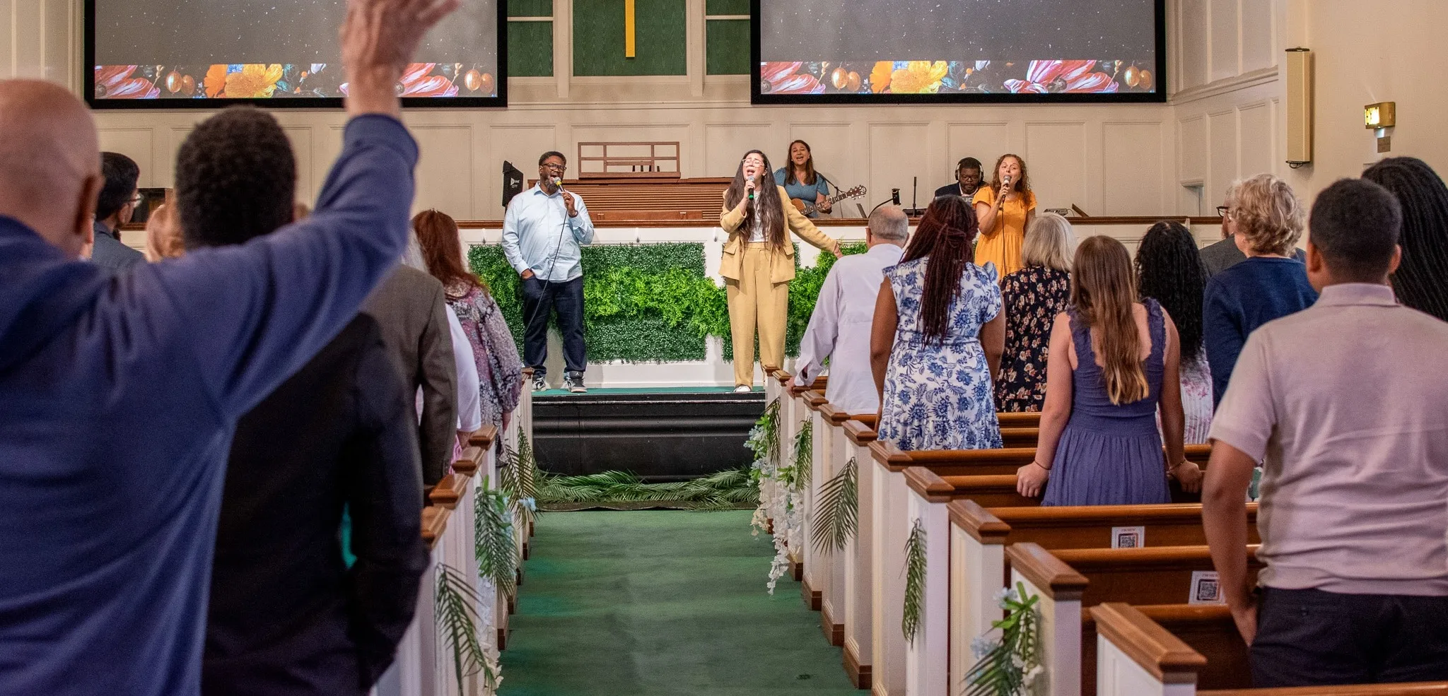 The sanctuary full of people worshiping on Easter Sunday